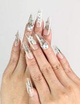 Model wearing Glisten Dream handmade Singapore press on nails with silver glitter and embellishments by naillover